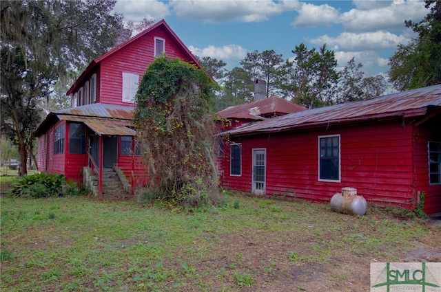 back of house with a yard