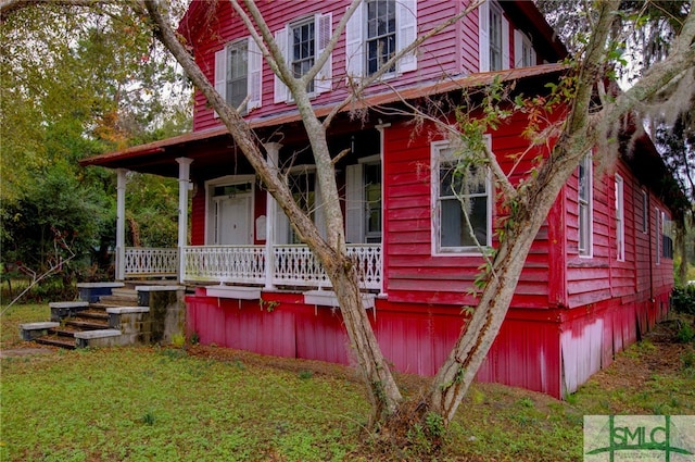 exterior space with a yard and a porch