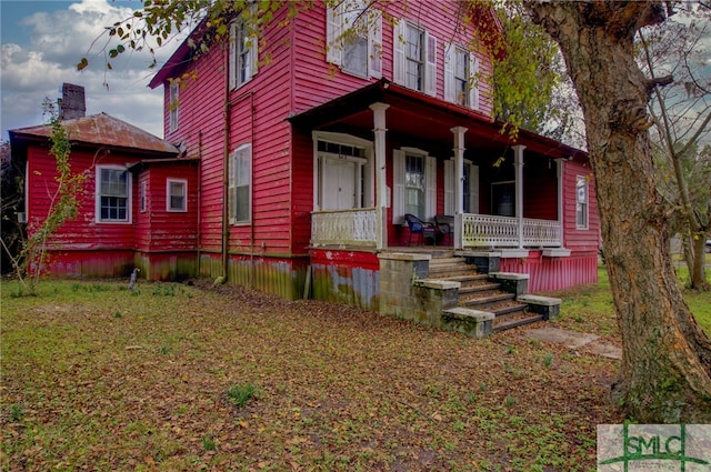 view of front of home featuring covered porch