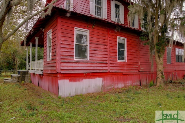 view of property exterior featuring a yard