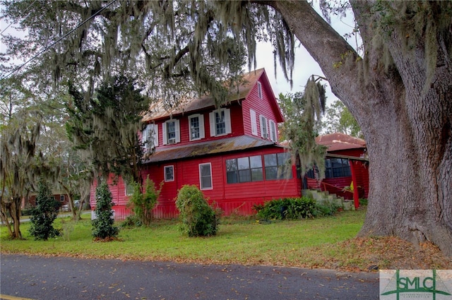 view of property exterior featuring a yard