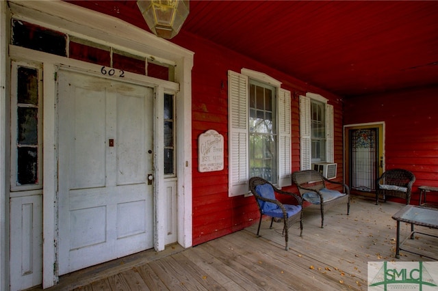 entrance to property featuring a porch