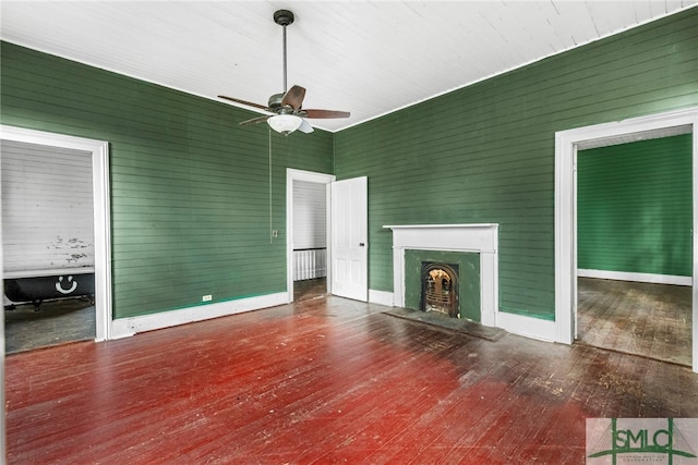 unfurnished living room with a fireplace, hardwood / wood-style flooring, and ceiling fan