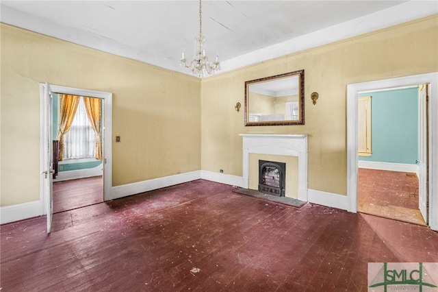 unfurnished living room with dark wood-type flooring and an inviting chandelier