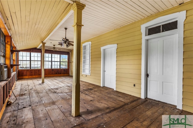 interior space with wood ceiling, ceiling fan, and vaulted ceiling