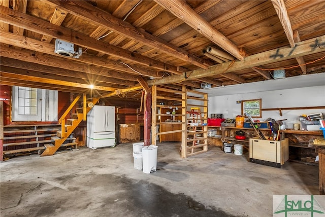 basement featuring white fridge