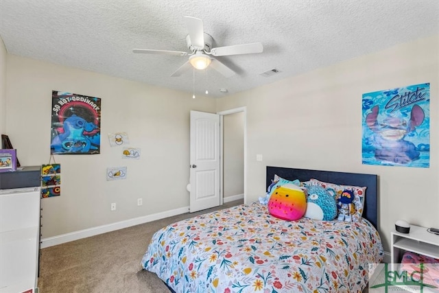 bedroom featuring a textured ceiling, carpet flooring, and ceiling fan