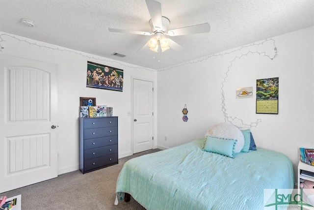 bedroom with carpet, a textured ceiling, and ceiling fan