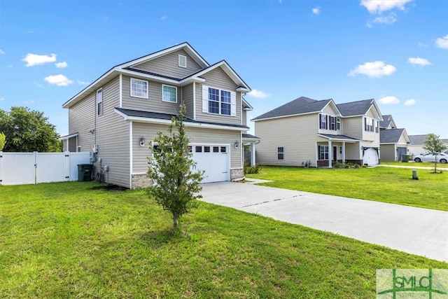 view of front of home featuring a garage and a front yard