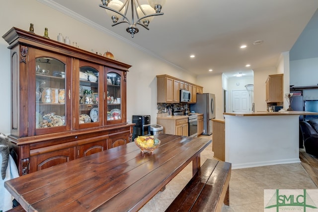 dining room with light tile patterned floors, a notable chandelier, recessed lighting, and crown molding