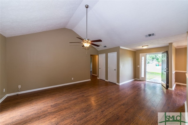 unfurnished living room with a textured ceiling, dark hardwood / wood-style flooring, vaulted ceiling, and ceiling fan