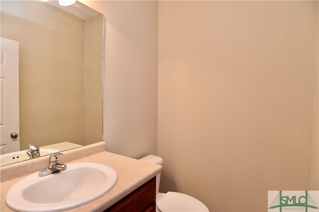 bathroom with vanity and toilet