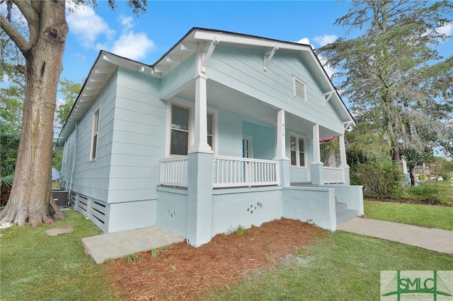 bungalow-style house with a porch and a front yard