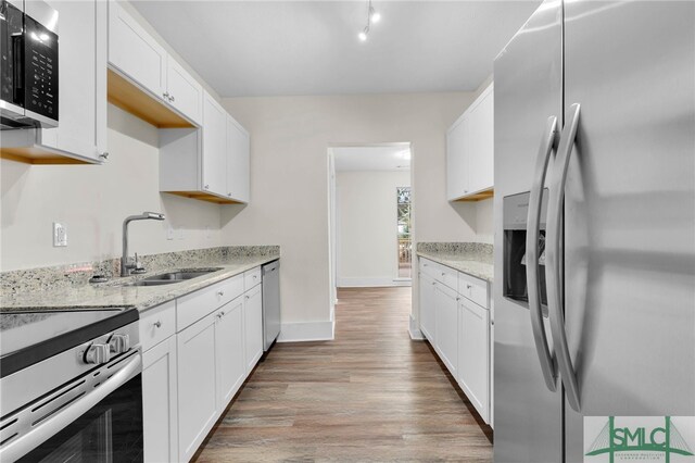 kitchen featuring white cabinets, sink, and appliances with stainless steel finishes