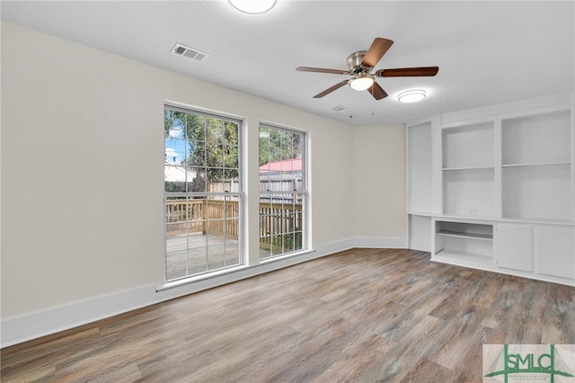 unfurnished living room with ceiling fan and light hardwood / wood-style flooring