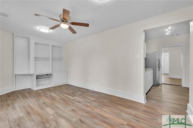 interior space featuring light hardwood / wood-style flooring and ceiling fan