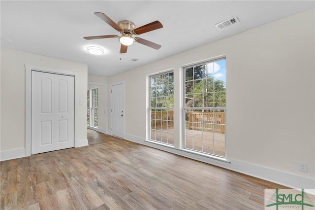 unfurnished room featuring ceiling fan and light hardwood / wood-style flooring