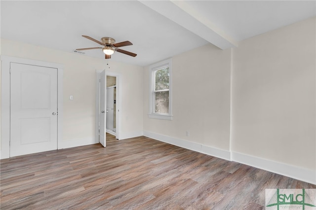 unfurnished room featuring hardwood / wood-style floors and ceiling fan