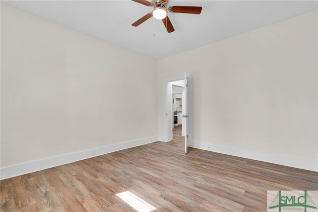 unfurnished room featuring ceiling fan and light wood-type flooring