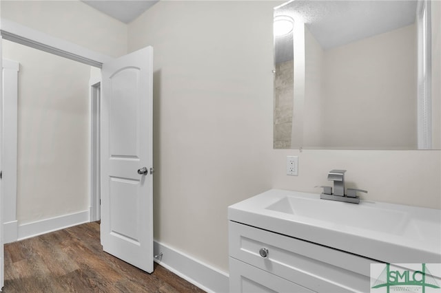 bathroom featuring wood-type flooring and vanity