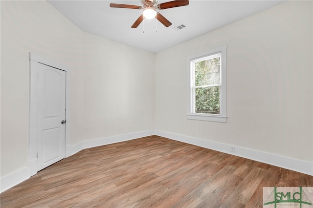 spare room featuring light hardwood / wood-style flooring and ceiling fan