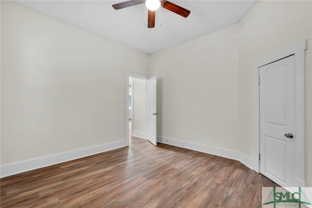 spare room with hardwood / wood-style flooring and ceiling fan