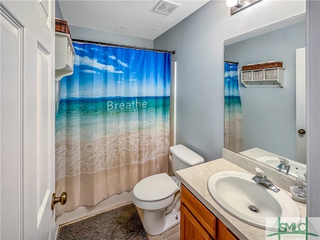 full bathroom with a textured ceiling, shower / bathtub combination with curtain, vanity, tile patterned floors, and toilet