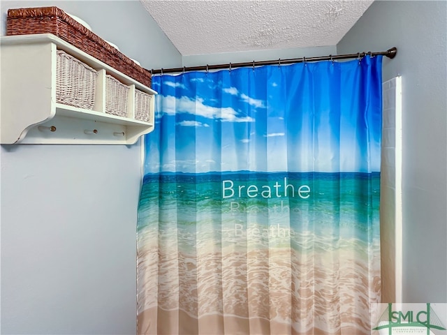 bathroom with a textured ceiling