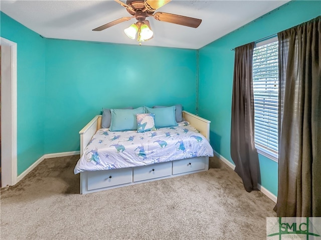 carpeted bedroom featuring ceiling fan