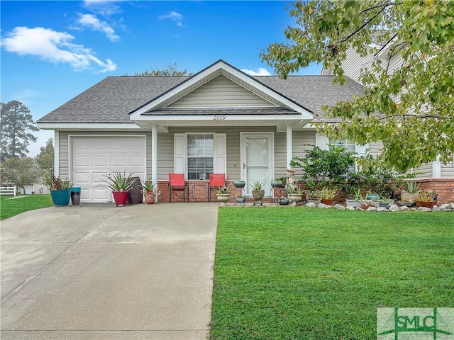 view of front of house with a garage, a porch, and a front lawn