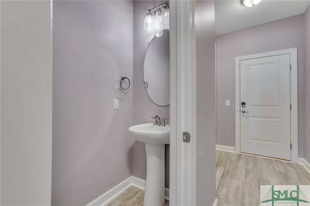 bathroom featuring hardwood / wood-style floors and sink