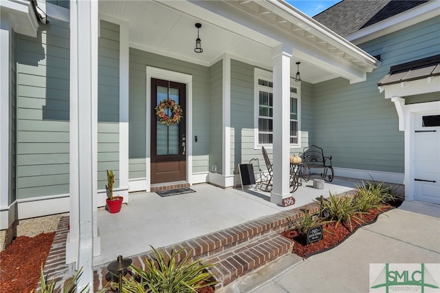 entrance to property with covered porch