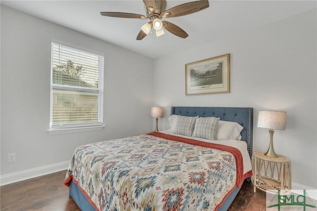 bedroom with ceiling fan and dark wood-type flooring