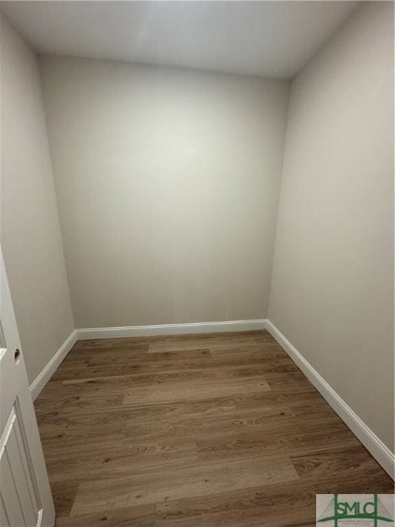 spare room featuring wood-type flooring