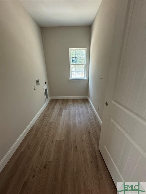 empty room featuring wood-type flooring