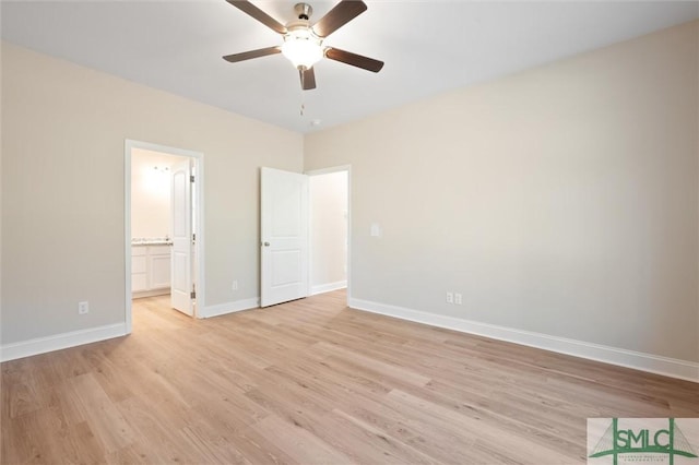 unfurnished bedroom featuring ceiling fan, light wood finished floors, ensuite bath, and baseboards