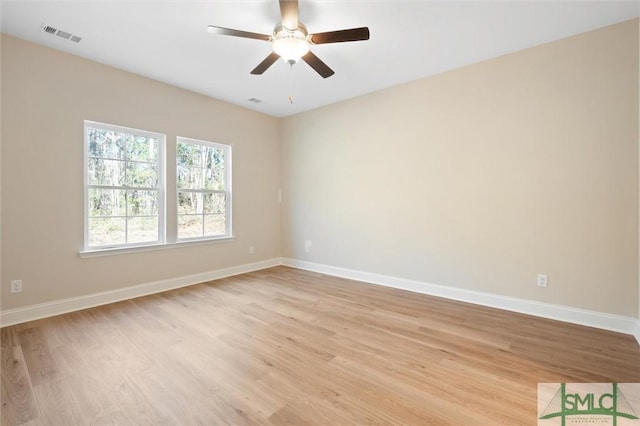 unfurnished room featuring visible vents, ceiling fan, light wood-style flooring, and baseboards