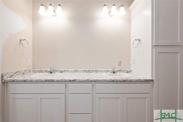 full bathroom featuring double vanity and a sink