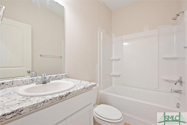 bathroom with vanity, toilet, and shower / bathtub combination