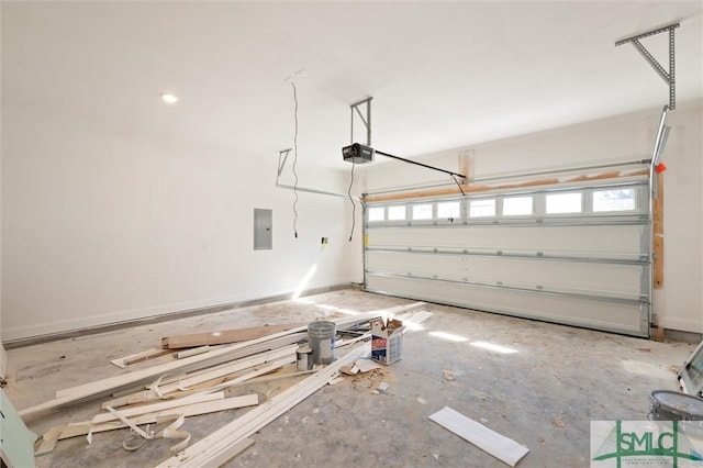 garage with electric panel, baseboards, and a garage door opener