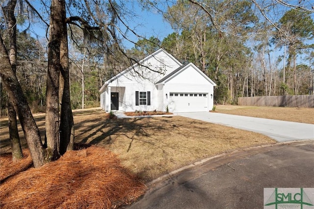 view of front facade featuring a garage, concrete driveway, fence, and a front lawn