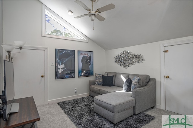 carpeted living room with ceiling fan and lofted ceiling