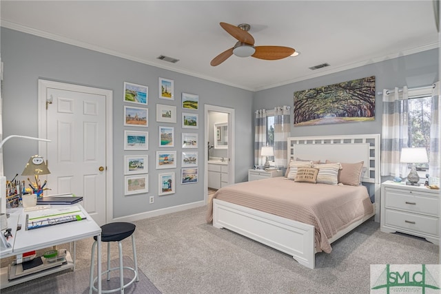 carpeted bedroom with ensuite bathroom, ornamental molding, and ceiling fan