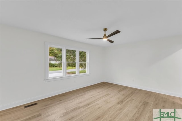 spare room featuring ceiling fan and light hardwood / wood-style flooring