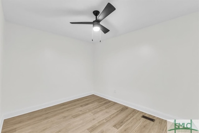 spare room featuring light hardwood / wood-style flooring and ceiling fan