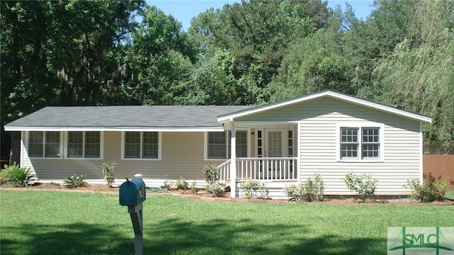 ranch-style home with a porch and a front lawn