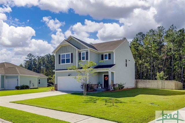 view of front of property featuring a garage and a front lawn