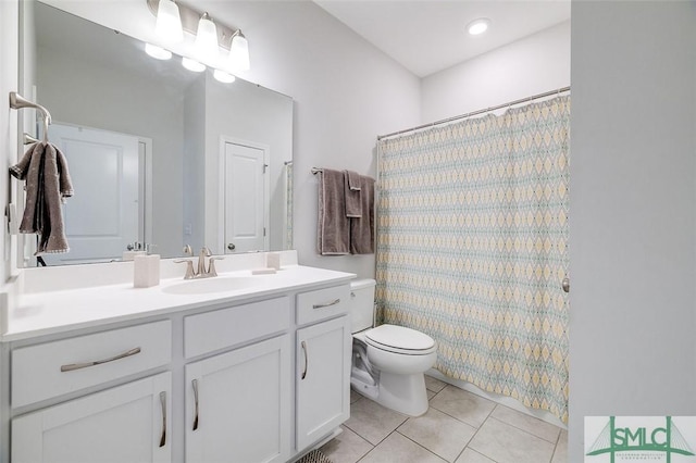 bathroom featuring vanity, a shower with curtain, tile patterned floors, and toilet