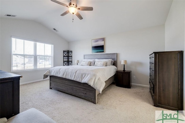 bedroom featuring lofted ceiling, light colored carpet, and ceiling fan