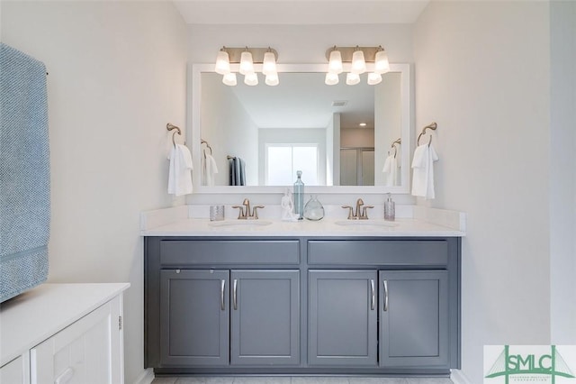 bathroom with vanity and an enclosed shower